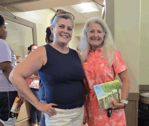 Two women stand at 2025 Party in the Park